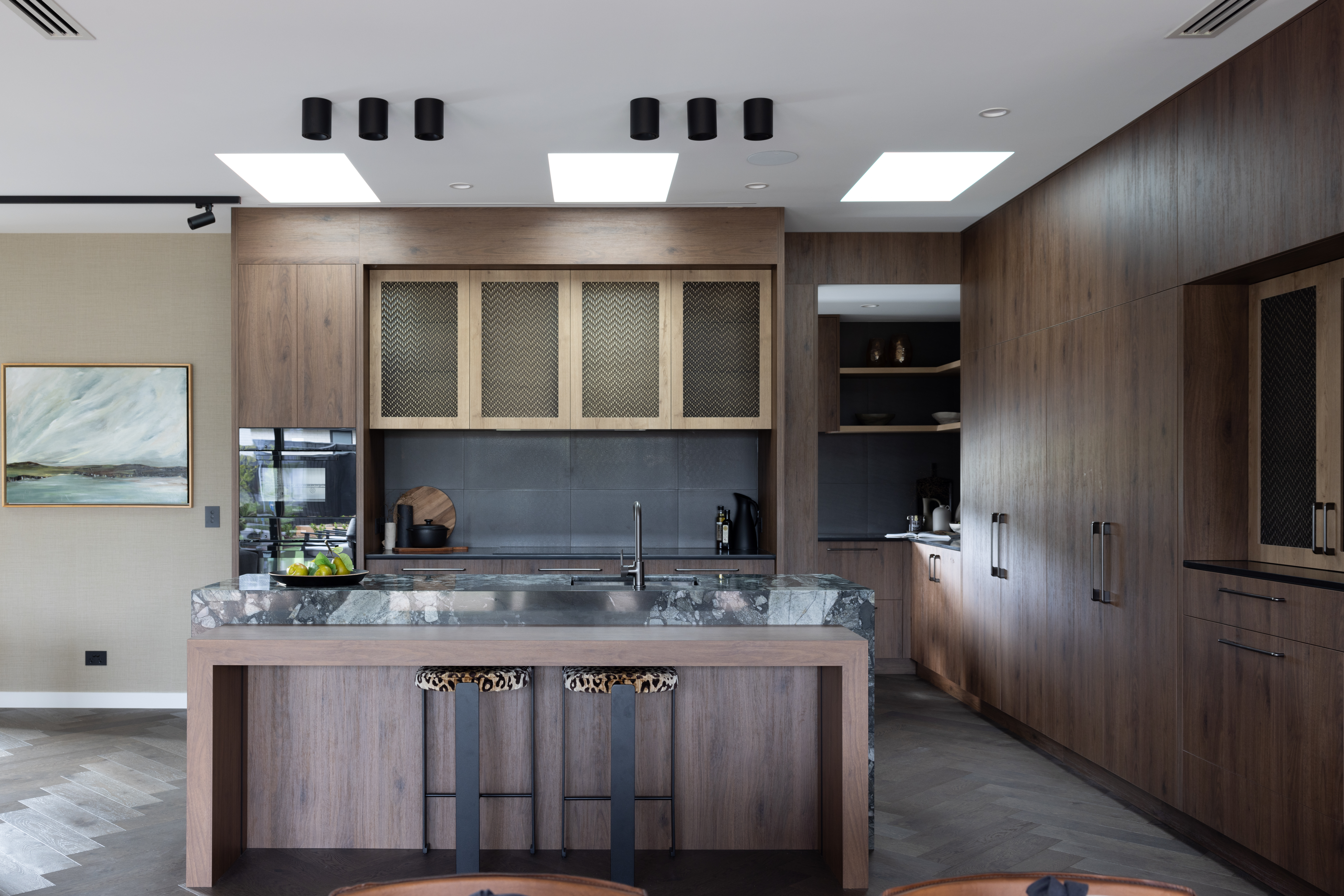 This image showcases a kitchen project featuring a Staten Brushed Brass Wovenpanel by Archant