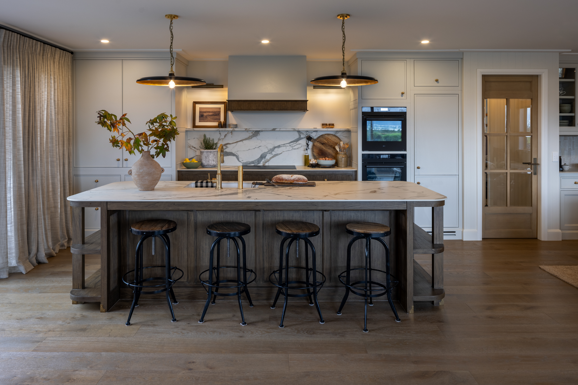 This image showcases a kitchen project featuring a Florim Stone Marfil