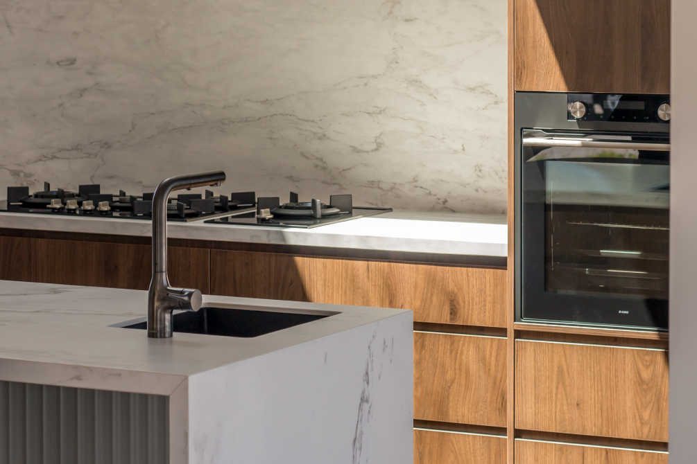 This image showcases a kitchen project featuring a Florim Stone Marfil