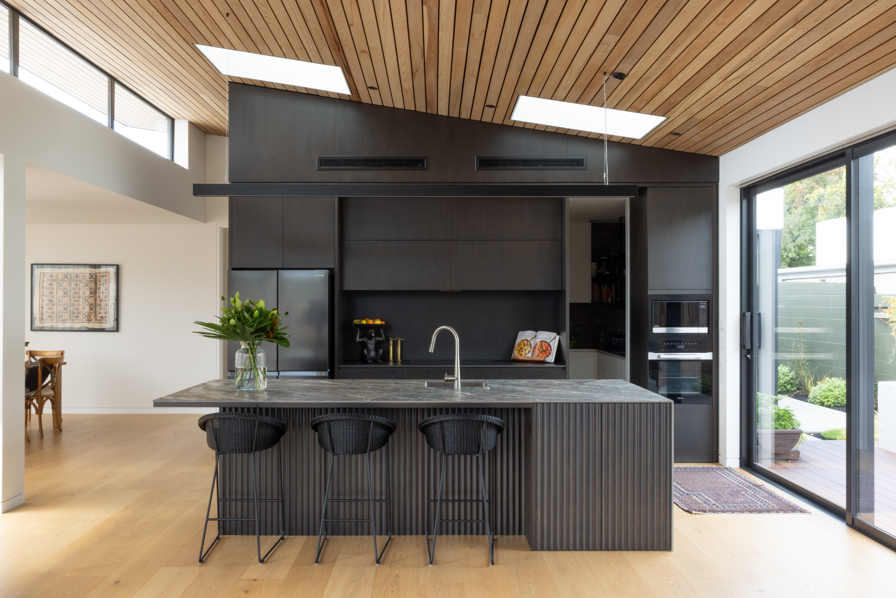 This image showcases a kitchen project featuring a Florim Stone Marfil