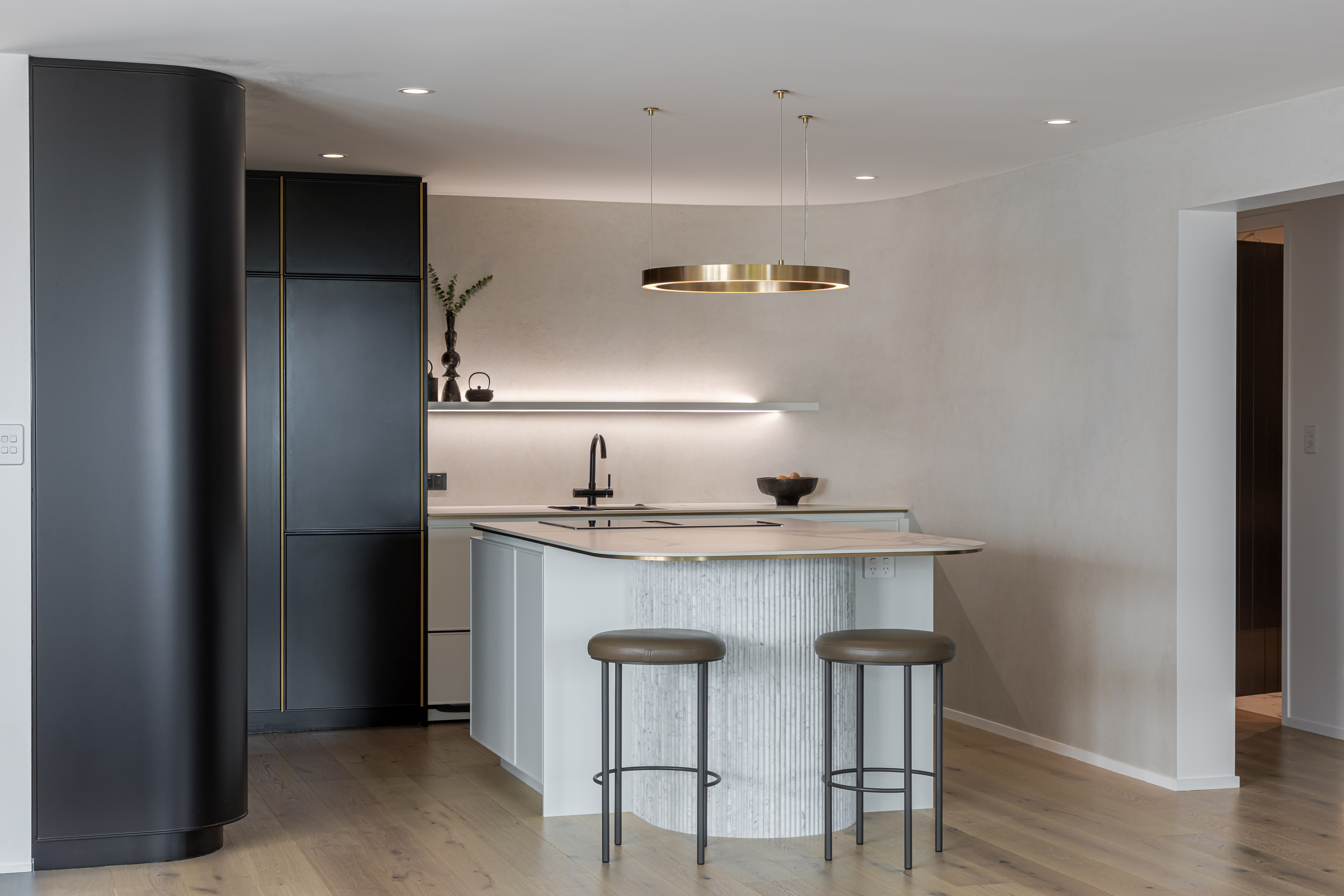 This image showcases a kitchen project featuring a Florim Stone Marfil