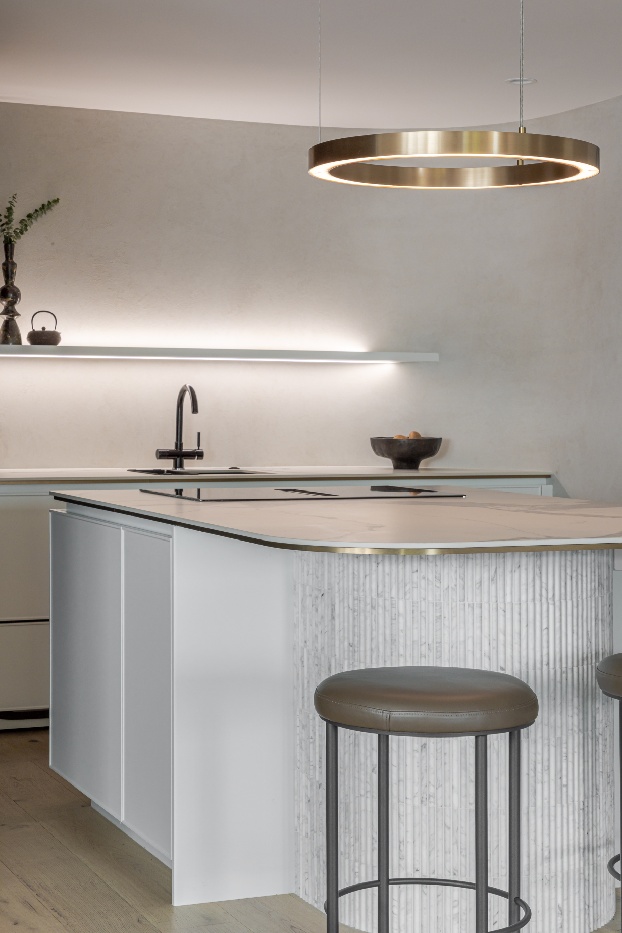 This image showcases a kitchen project featuring a Florim Stone Marfil
