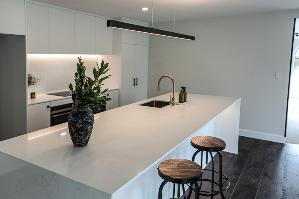 This image showcases a kitchen project featuring a Florim Stone Marfil