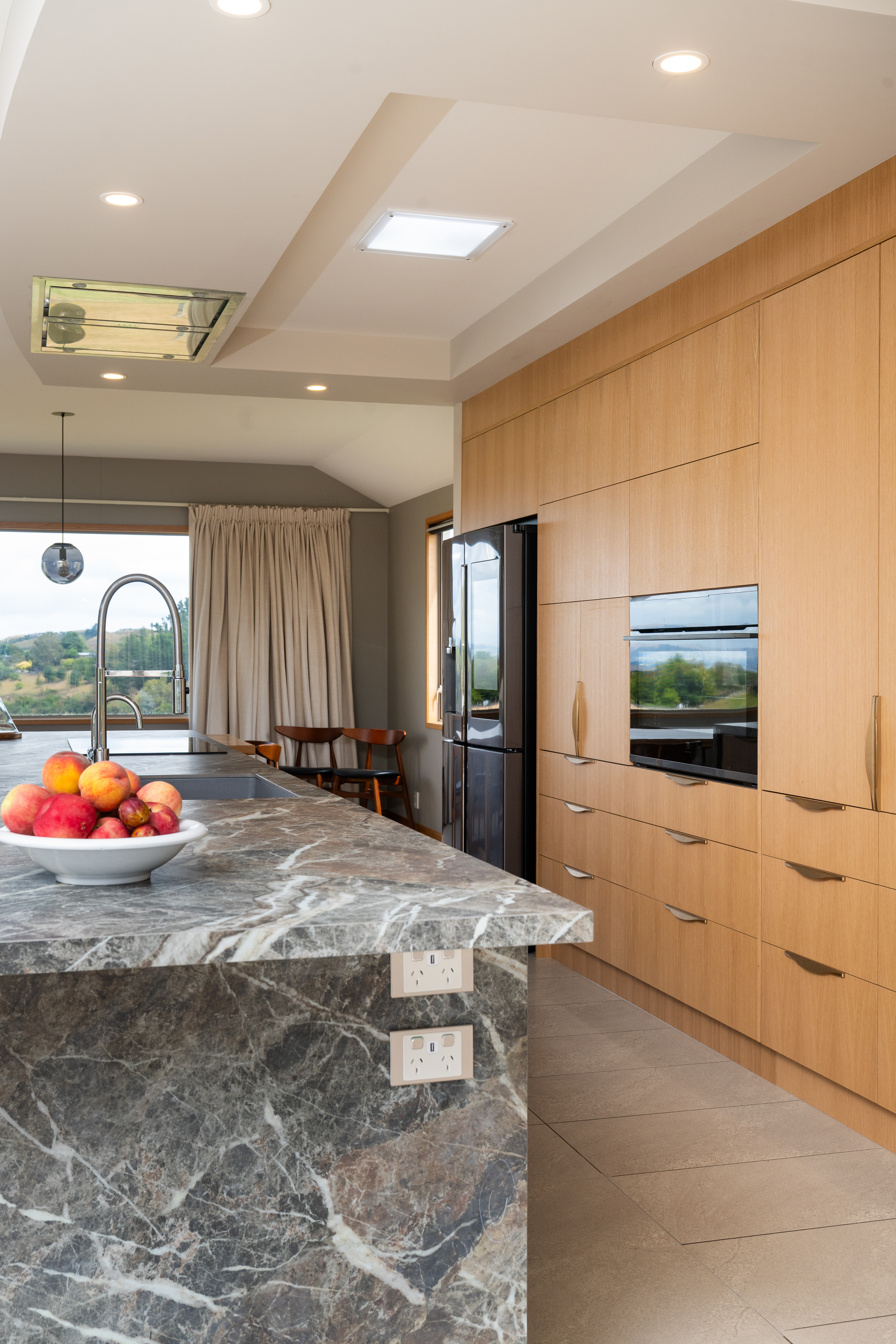 This image showcases a kitchen project featuring a Florim Stone Marfil