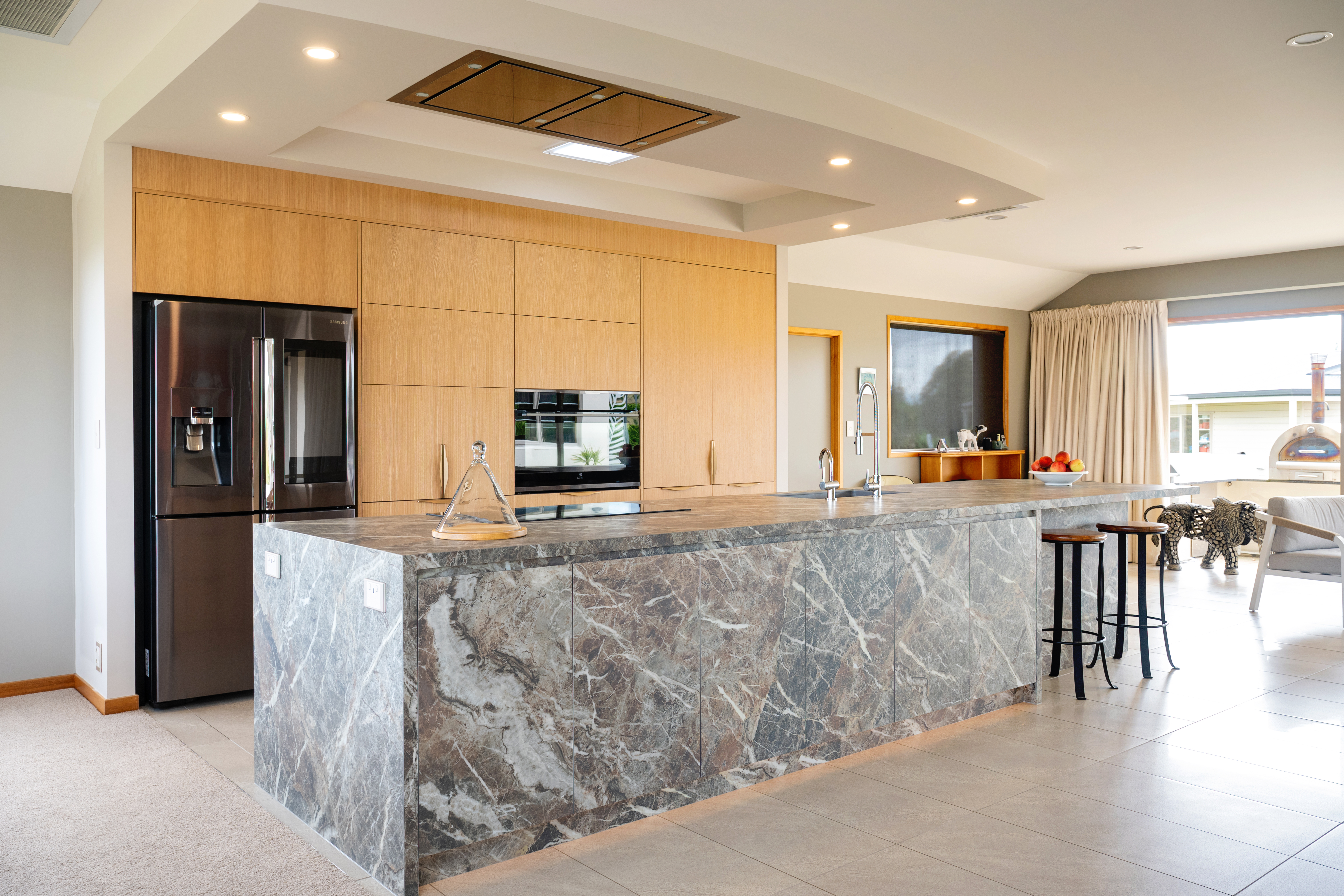 This image showcases a kitchen project featuring a Florim Stone Marfil