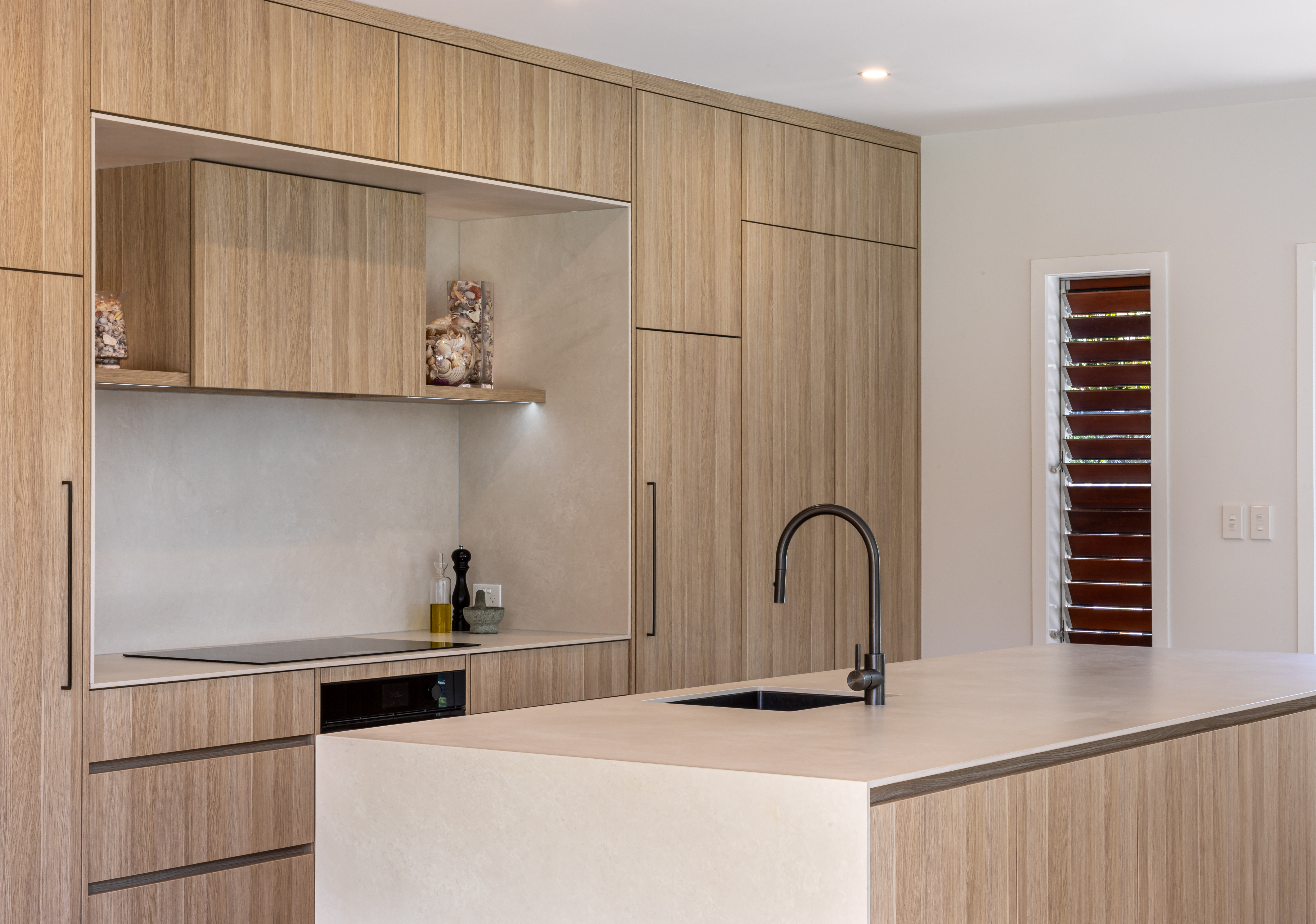 This image showcases a kitchen project featuring a Florim Stone Marfil