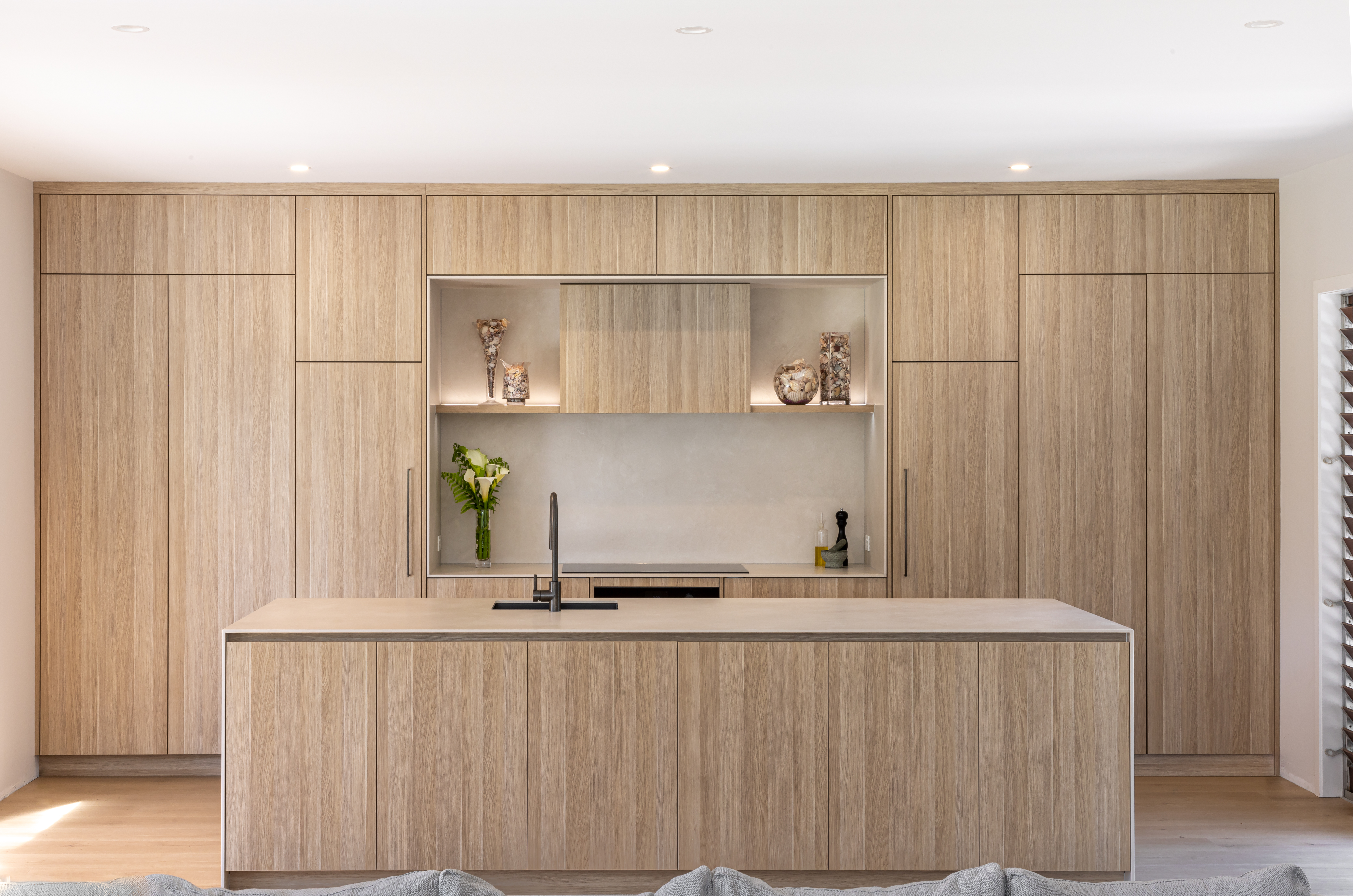 This image showcases a kitchen project featuring a Florim Stone Marfil