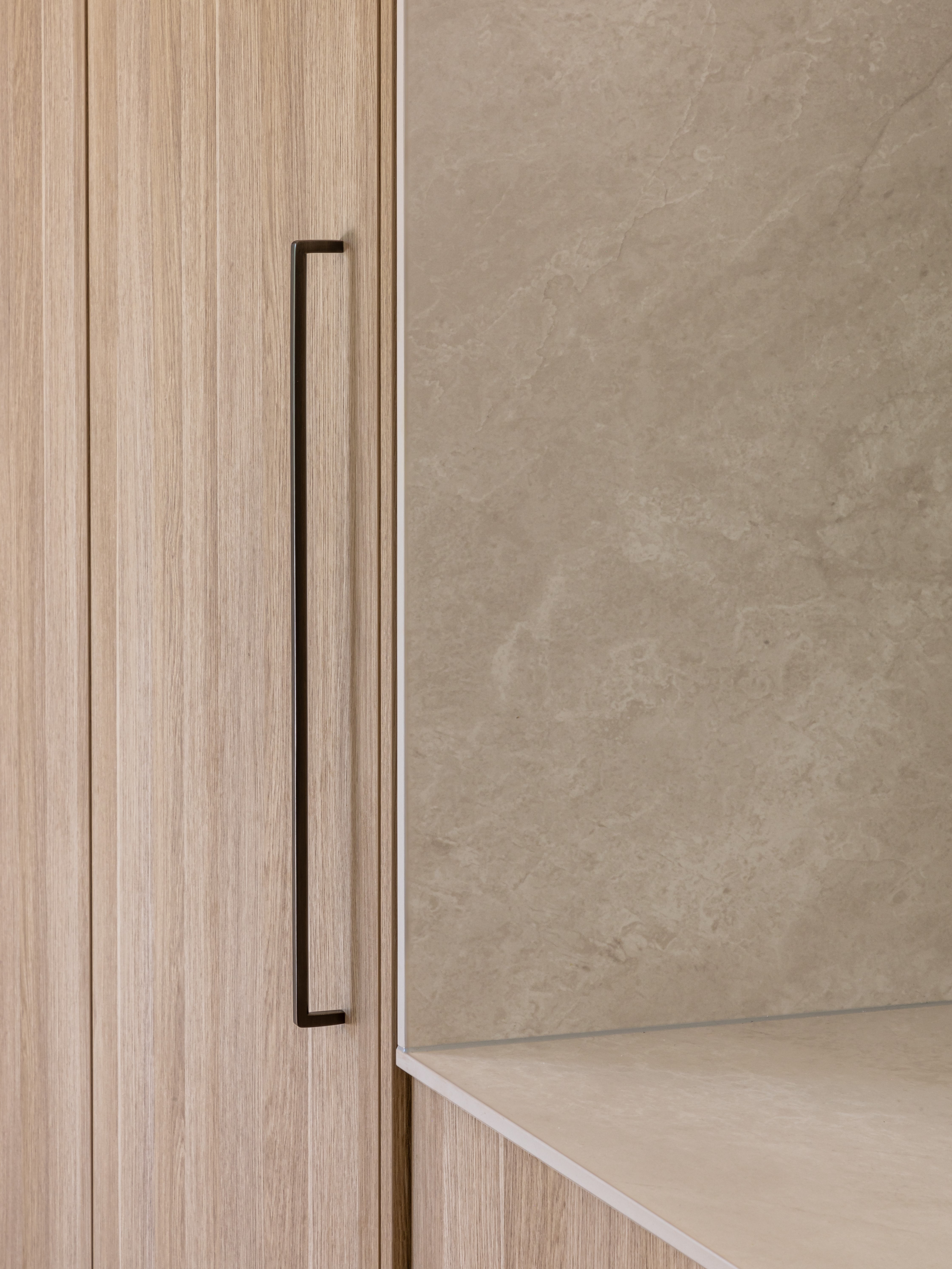 This image showcases a kitchen project featuring a Florim Stone Marfil